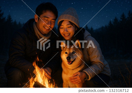 Shiba Inu couple cuddling by a bonfire in winter Shiba Inu couple cuddling by a bonfire in winter 132316712