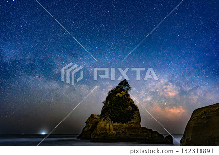 Rock breaking through the Milky Way 132318891