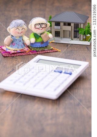 An elderly couple and their miniature house (+calculator) An elderly couple and their miniature house (+calculator) 132319366
