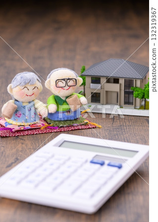 An elderly couple and their miniature house (+calculator) An elderly couple and their miniature house (+calculator) 132319367
