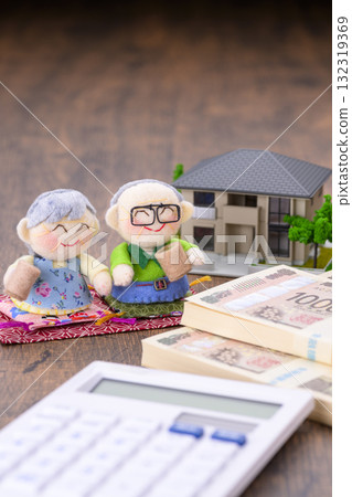 Miniature of an elderly couple and their house (plus a calculator and a stack of bills) Miniature of an elderly couple and their house (plus a calculator and a stack of bills) 132319369