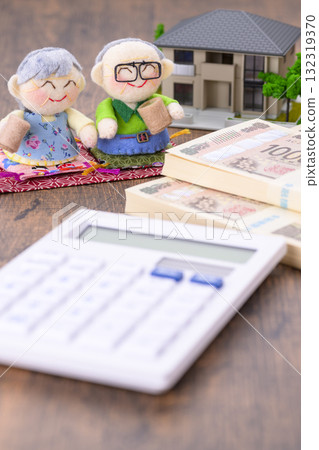 Miniature of an elderly couple and their house (plus a calculator and a stack of bills) Miniature of an elderly couple and their house (plus a calculator and a stack of bills) 132319370