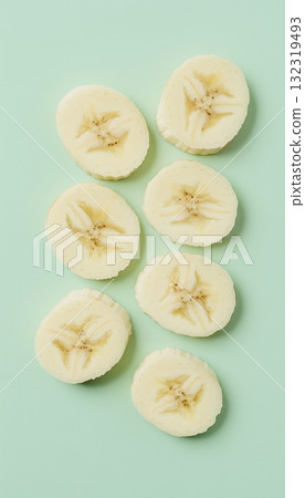 Banana slice fresh organic fruit arranged with soft blue vertical background Banana slice fresh organic fruit arranged with soft blue vertical background 132319493