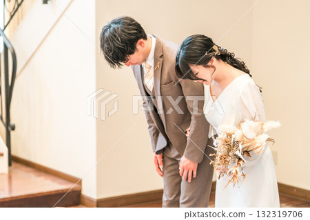 Bride and groom entering the wedding reception hall Bride and groom entering the wedding reception hall 132319706