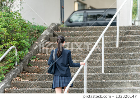 Junior high school and high school girls in uniforms going to school Junior high school and high school girls in uniforms going to school 132320147