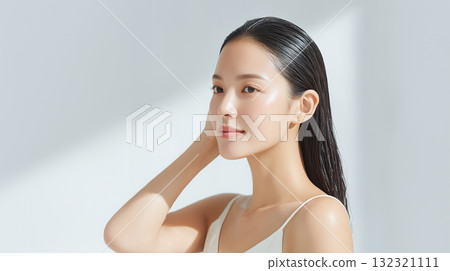 Woman taking care of her hair [Beauty advertisement] 132321111