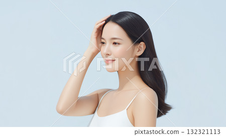 Woman taking care of her hair [Beauty advertisement] 132321113