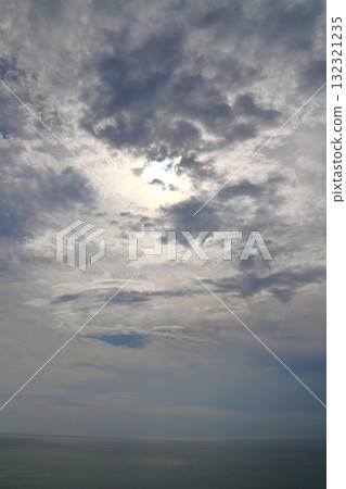 Cloudy sky, sun, sea Cloudy sky, sun, sea 132321235