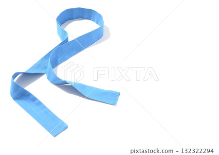 Blue headband photographed against a white background Blue headband photographed against a white background 132322294
