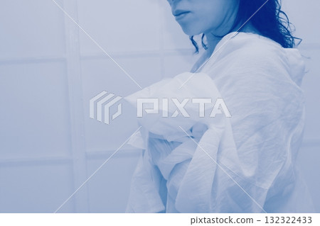 A woman wearing a white long shirt 132322433