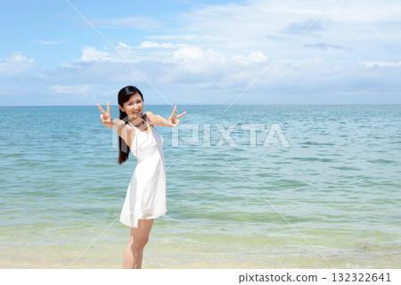 woman relaxing on the beach woman relaxing on the beach 132322641