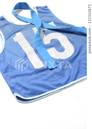 Blue bib and blue headband photographed against a white background 132322671
