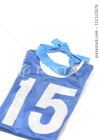 Blue bib and blue headband photographed against a white background 132322676