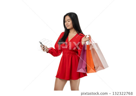 Woman with shopping bags looking at her phone, isolated on white, PNG Woman with shopping bags looking at her phone, isolated on white, PNG 132322768