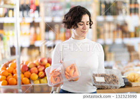 Adult woman chooses prawns or purple dye murex (Bolinus brandaris) Adult woman chooses prawns or purple dye murex (Bolinus brandaris) 132323090