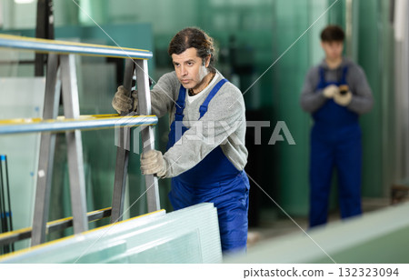 Adult man worker with rack at glass factory Adult man worker with rack at glass factory 132323094