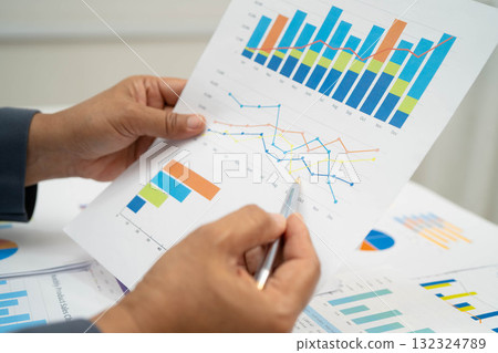 Asian business woman working with financial graph. 132324789