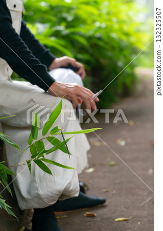 Cigarette, man in knickerbockers, hand 132325507