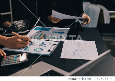 Accounting company provide finance and taxation planning for profitable cash flow, Auditor and accountant team working in office, analyze financial data and accounting record with calculator.Insight 132325582