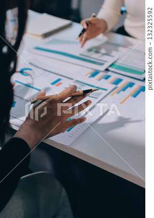Accounting company provide finance and taxation planning for profitable cash flow, Auditor and accountant team working in office, analyze financial data and accounting record with calculator.Insight Accounting company provide finance and taxation planning for profitable cash flow, Auditor and accountant team working in office, analyze financial data and accounting record with calculator.Insight 132325592
