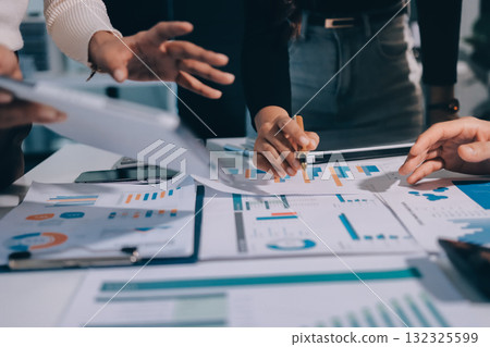 Accounting company provide finance and taxation planning for profitable cash flow, Auditor and accountant team working in office, analyze financial data and accounting record with calculator.Insight Accounting company provide finance and taxation planning for profitable cash flow, Auditor and accountant team working in office, analyze financial data and accounting record with calculator.Insight 132325599