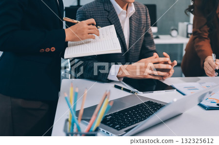 Accounting company provide finance and taxation planning for profitable cash flow, Auditor and accountant team working in office, analyze financial data and accounting record with calculator.Insight Accounting company provide finance and taxation planning for profitable cash flow, Auditor and accountant team working in office, analyze financial data and accounting record with calculator.Insight 132325612