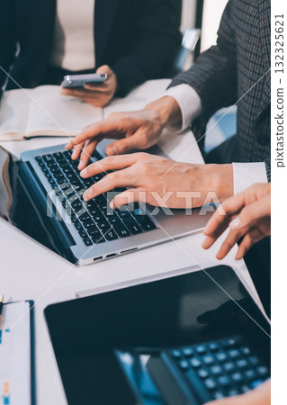 Accounting company provide finance and taxation planning for profitable cash flow, Auditor and accountant team working in office, analyze financial data and accounting record with calculator.Insight 132325621