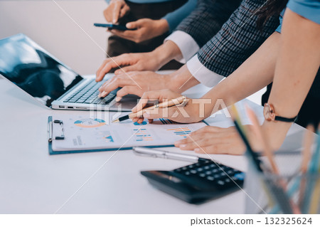 Accounting company provide finance and taxation planning for profitable cash flow, Auditor and accountant team working in office, analyze financial data and accounting record with calculator.Insight 132325624