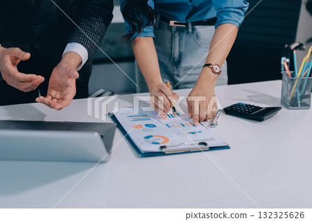 Accounting company provide finance and taxation planning for profitable cash flow, Auditor and accountant team working in office, analyze financial data and accounting record with calculator.Insight 132325626