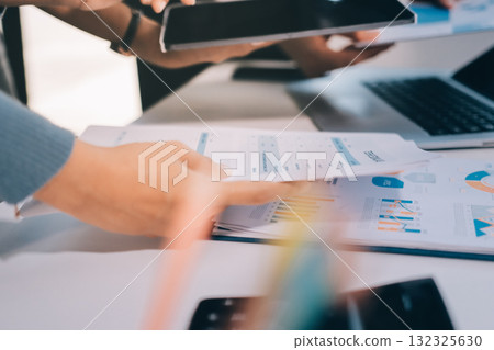 Accounting company provide finance and taxation planning for profitable cash flow, Auditor and accountant team working in office, analyze financial data and accounting record with calculator.Insight Accounting company provide finance and taxation planning for profitable cash flow, Auditor and accountant team working in office, analyze financial data and accounting record with calculator.Insight 132325630