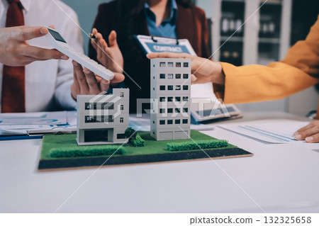 Real estate agent and customer signing contract to buy house, insurance or loan real estate.rent a house,get insurance or loan real estate or property. 132325658