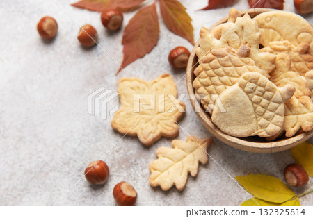 Autumn cookies with nuts and colorful leaves Autumn cookies with nuts and colorful leaves 132325814