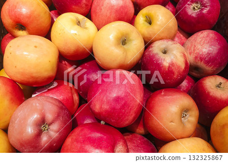 Fresh red apples displayed at farmers market. Variety of shiny edible produce for grocery retail concepts. 132325867