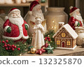 Store displaying Christmas decorations with Santa Claus and angel figurines. Traditional holiday ceramic. 132325870