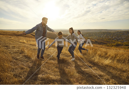 Happy family nature outdoor vacation, playing, spending weekend holiday together Happy family nature outdoor vacation, playing, spending weekend holiday together 132325948