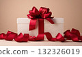 Elegant White Gift Box with Red Ribbon and Bow on a Soft Beige Background 132326019