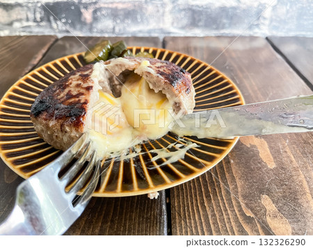 Cheese hamburger steak. When you cut it, the cheese oozes out. Cheese hamburger steak. When you cut it, the cheese oozes out. 132326290