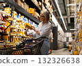 Shopping for home improvement supplies in a hardware store aisle during daylight hours 132326638
