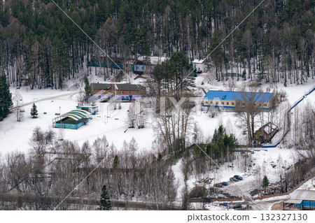 A tourist base nestled among the trees in the mountains in winter. 132327130