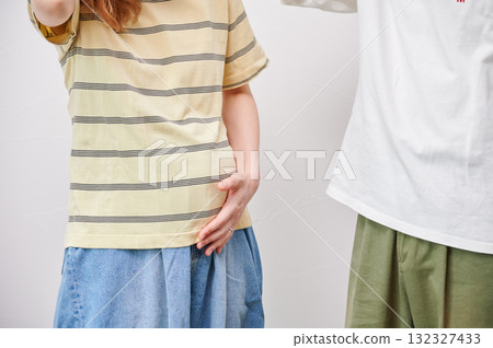 Couple facing each other, pregnant woman, maternity 132327433