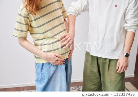 Couple facing each other, pregnant woman, maternity 132327456