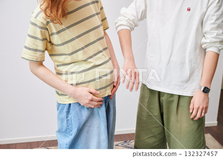 Couple facing each other, pregnant woman, maternity 132327457