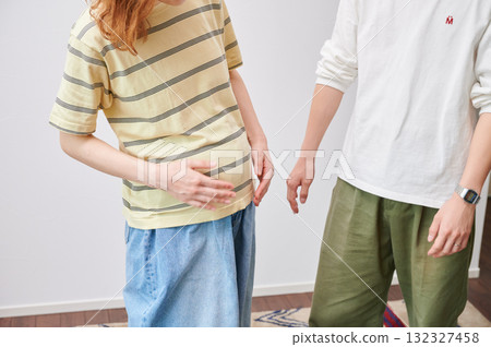 Couple facing each other, pregnant woman, maternity 132327458