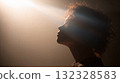 Silhouette Of A Person In Backlit Light, Moody Portrait With Sun Rays And Soft Glow 132328583