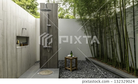 Outdoor shower surrounded by bamboo and rocks in a tranquil garden setting Outdoor shower surrounded by bamboo and rocks in a tranquil garden setting 132329024
