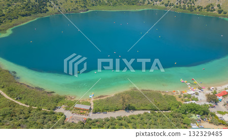 Panoramic aerial landscape of Lake Kournas, showing vibrant blue water, surrounding natural areas Panoramic aerial landscape of Lake Kournas, showing vibrant blue water, surrounding natural areas 132329485