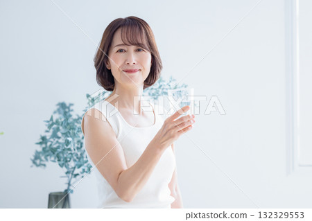Beauty image: Senior woman drinking water 132329553