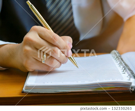 Hands taking notes Hands taking notes 132330263