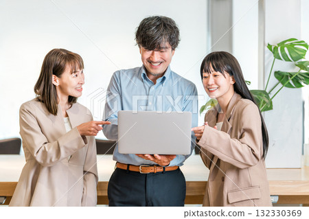 Boss in a company office, male executive businessman and assistant, female secretary staff Boss in a company office, male executive businessman and assistant, female secretary staff 132330369