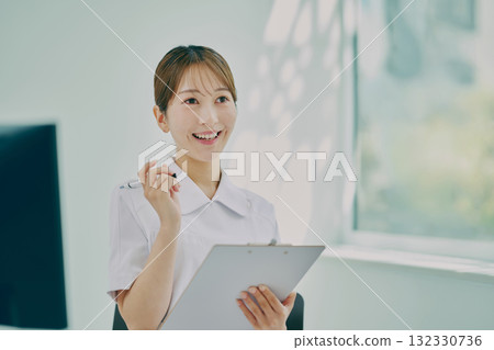Female nurse providing counseling Female nurse providing counseling 132330736